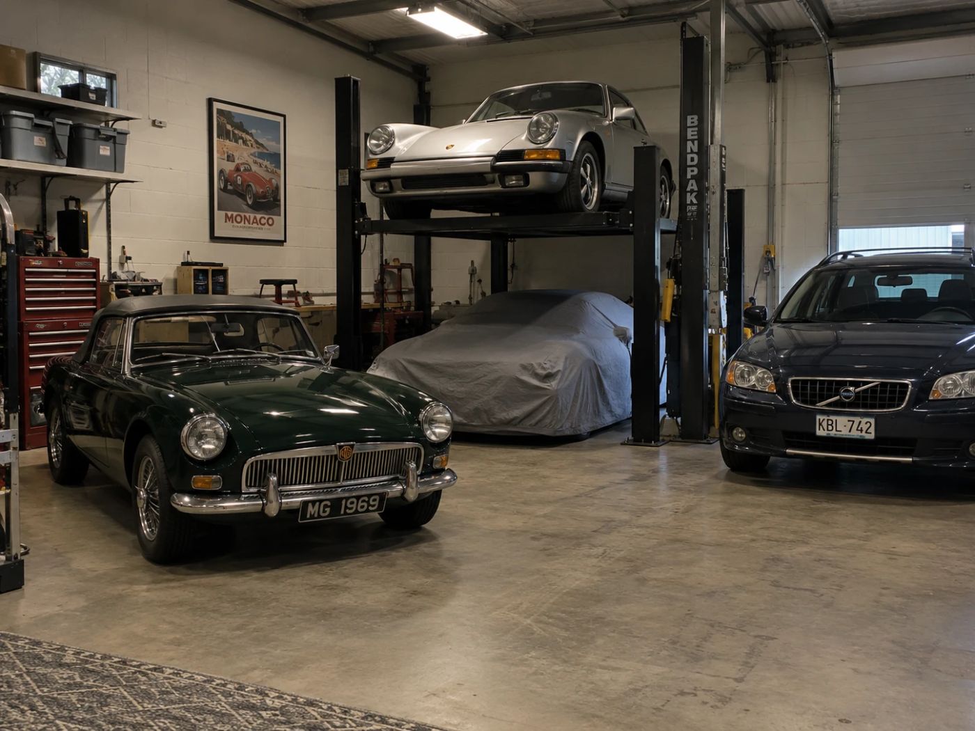Classic sports car stored in a clean indoor garage with a car lift (example for car storage in Chullora)